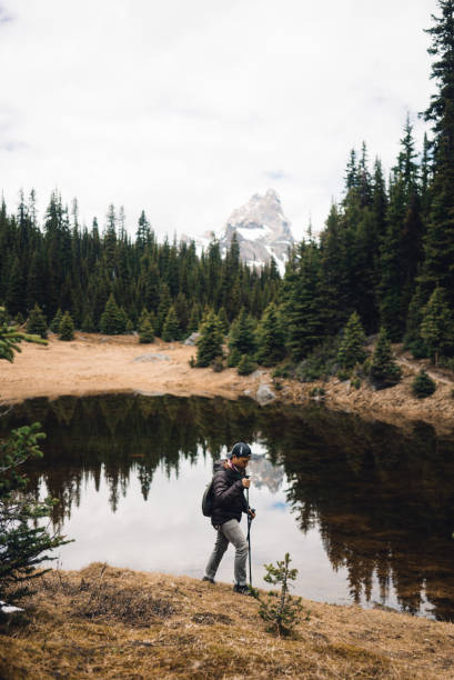 In the summer time, a man hikes through the forest to find time for himself and the surrounding beautiful nature.
