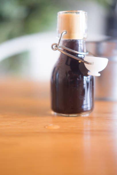 istock Espresso shot in mini glass bottles on wood table 934027762