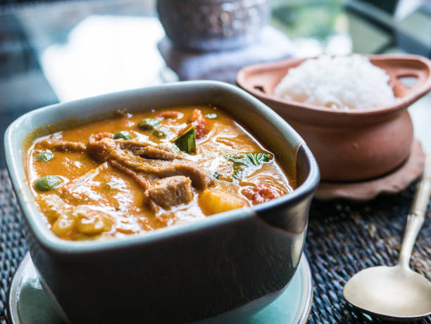istock Roasted duck yellow curry traditional Thai dish served with rice 934040402