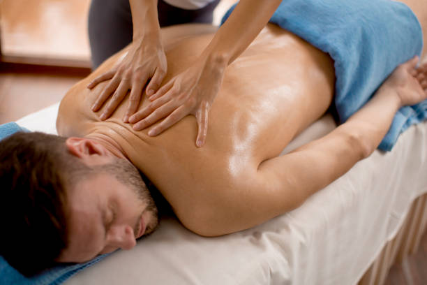 istock Young man having massage in the spa 934040878
