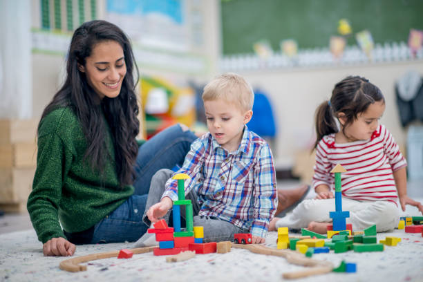 costruire insieme - block togetherness happiness indoors foto e immagini stock