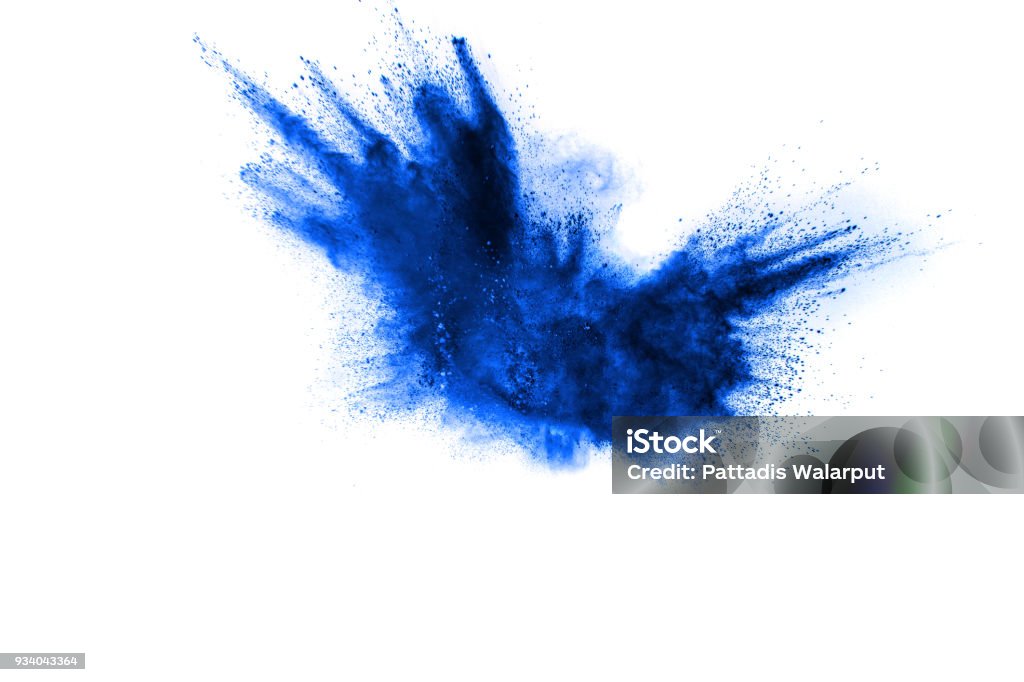 Blue color powder explosion cloud isolated on white background.Closeup of Blue dust particles splash isolated on  background. Blue Stock Photo