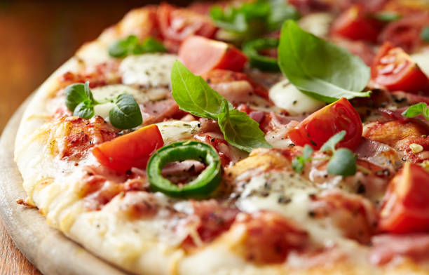 istock Pizza with prosciutto, cherry tomatoes and mozzarella 934051062