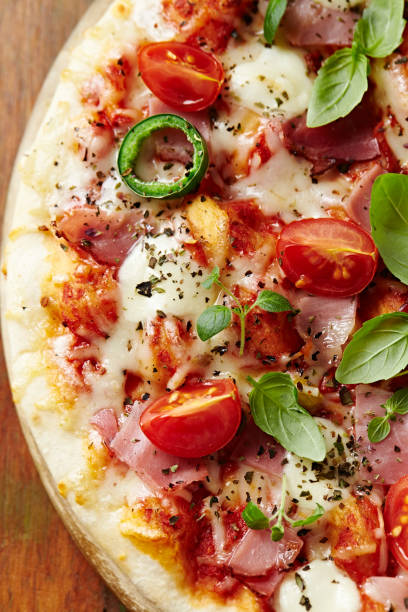 istock Pizza with prosciutto, cherry tomatoes and mozzarella 934051094