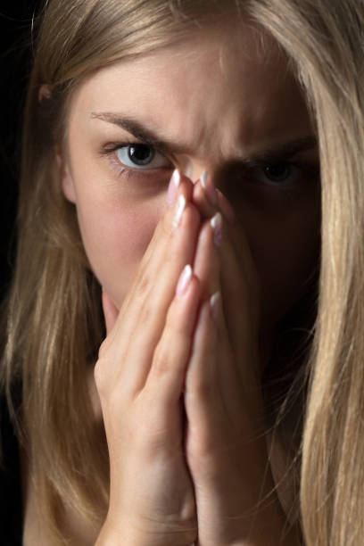 istock Depressed woman, hands covering face 934053452