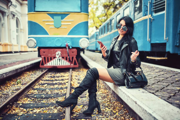istock Girl on a feather with a phone in her hand. 934056410