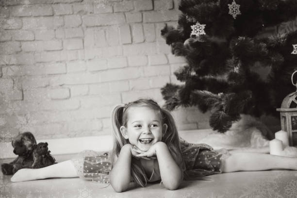 Happy girl near a Christmas tree.