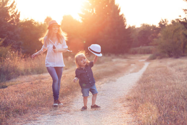 istock Little boy dancing and having fun with his mother 934061788