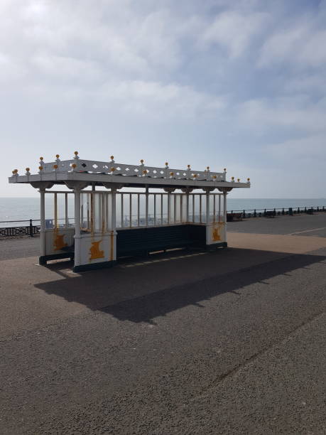 istock Seafront wind shelter along a promenade. 934066578