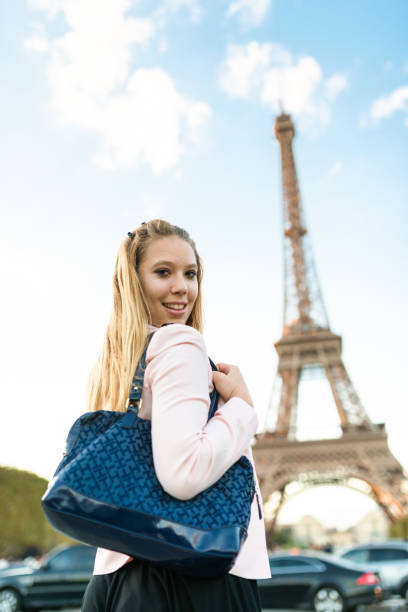 istock tourist woman in paris under the tour eiffel 934071092