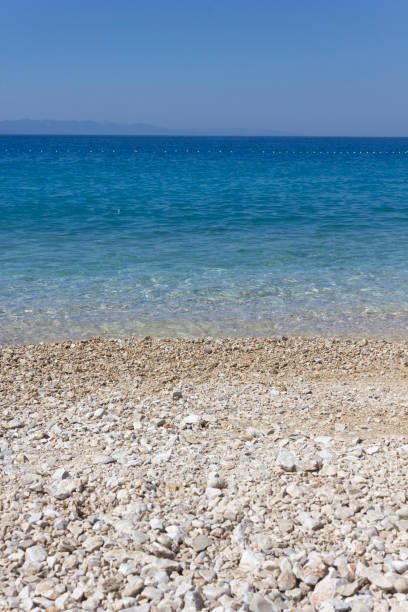 istock Stobrec beach with its white pebbles and crystalline beach 934074558