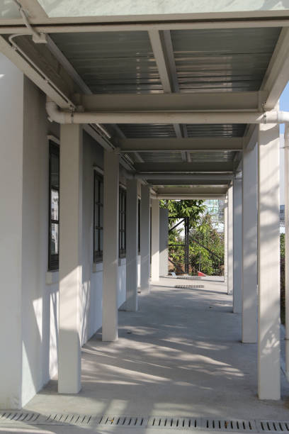 istock white outdoor corridor with sunshine and shadow 934080986