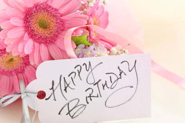 istock elegance pink gerbera and hand written Birthday card 934095138