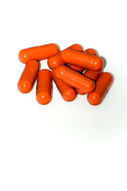 istock Lot of red pills on white background 934108134