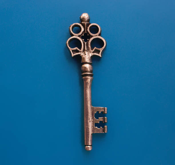 istock Isolated metal old key on the blue background 934113778