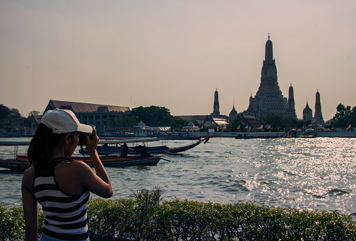 Tourist girl near Arun Wat in Bangkok