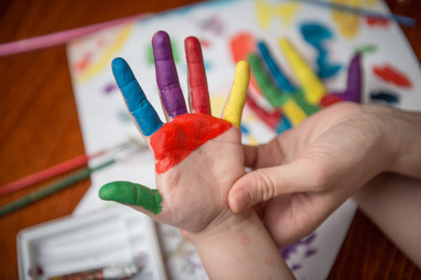istock Painting child hands in watercolor 934120068