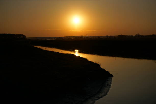 istock Beautiful sunset near the river 934122582