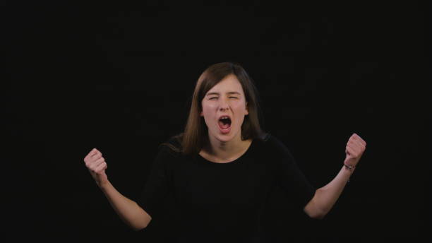 istock A Lady Shouting Against a Black Background 934122586