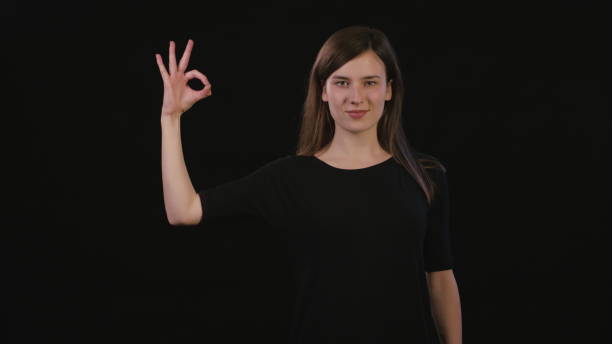 istock A Lady Mimicing Against a Black Background 934122686