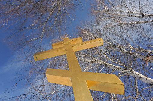 Christian cross on blue sky outdoor Easter Church