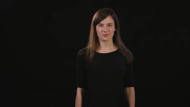 istock A Lady Mimicing Against a Black Background 934123066