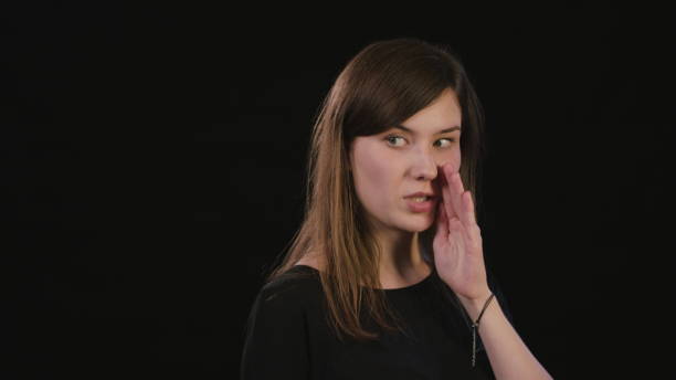 istock A Lady Mimicing Against a Black Background 934125838