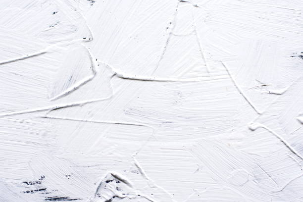 istock White painted cement background with broad brush strokes 934126028