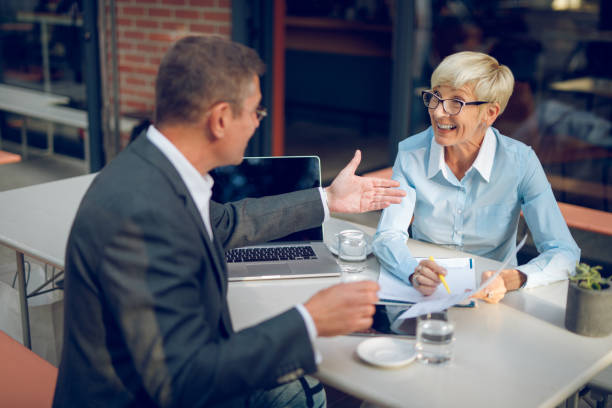 istock Mature business people collaborating after work 934132512
