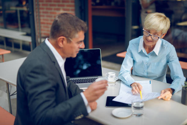 istock Mature business people collaborating after work 934135824