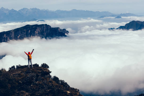 istock successful hiker in the beautiful landscape on mountain top 934136308