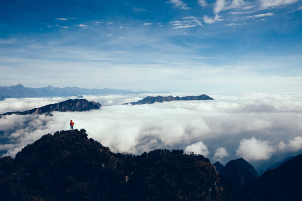 istock successful hiker in the beautiful landscape on mountain top 934138428