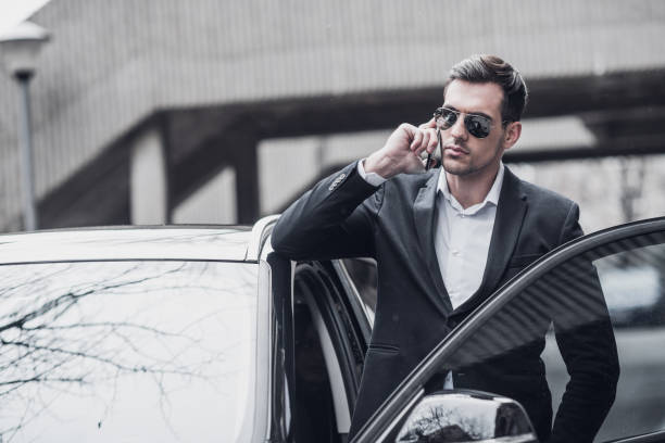 istock Handsome businessman enters a car 934139100