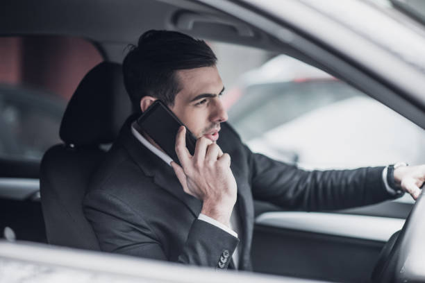 istock Handsome CEO talks on the phone 934139142