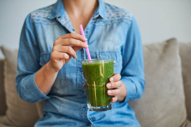 istock woman with smoothie 934141644