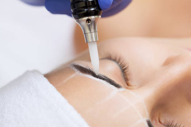 istock Permanent make-up for eyebrows of beautiful woman with thick brows in beauty salon 934141726