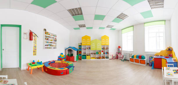istock Spacious white game room in the kindergarten. Wide Panoramic Picture 934145102