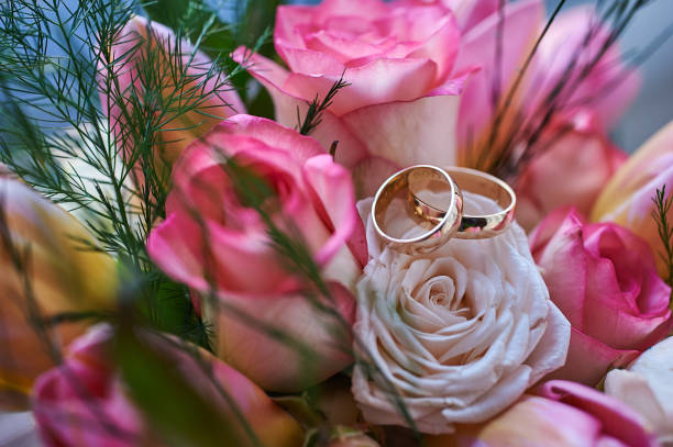 istock wedding rings on flowers 934147190