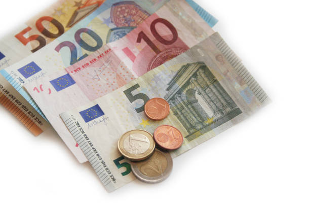 istock Euro banknote and coins on white 934153282