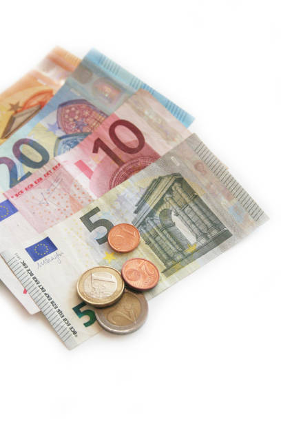 istock Euro banknote and coins on white 934153326