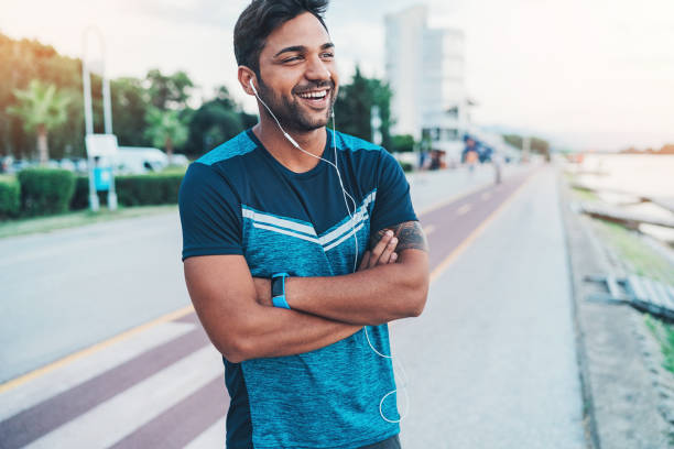 istock Happy athlete resting on the street 934181656