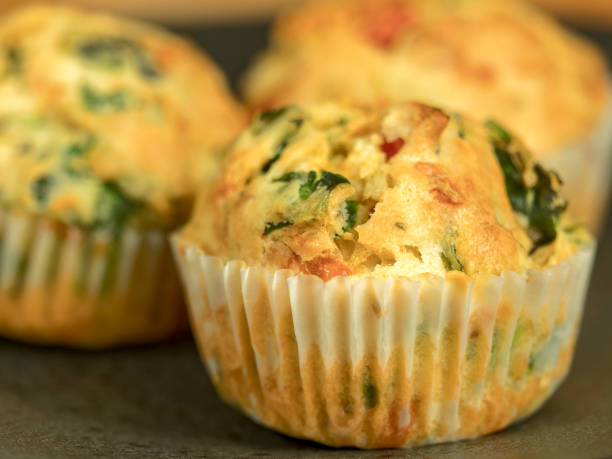 istock Freshly baked savory muffins with cheddar, spinach and bell pepper 934211462
