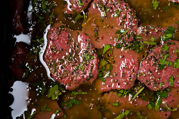 маринованный мяса - marinated стоковые фото и изображения