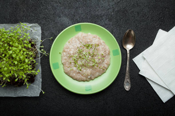 istock Dietary breakfast of oatmeal and micro greens. 934227440