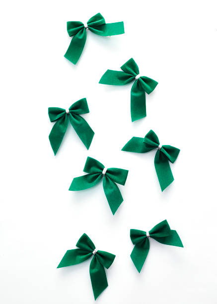 istock Green velvet bows on white background 934236738