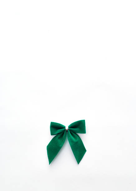 istock single green velvet bow isolated on white 934238822