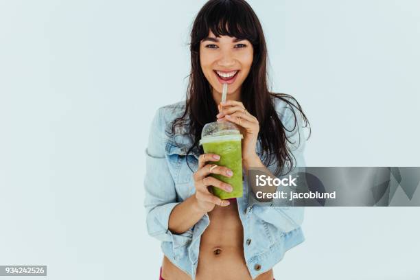 Beautiful Woman Drinking Fresh Green Smoothie Stock Photo - Download Image Now - Women, Smoothie, Drinking