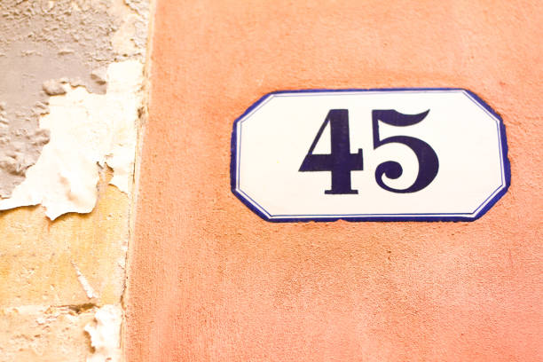 istock Italy: Ceramic Number 45 Street Address Tile; Pink Wall 934245418