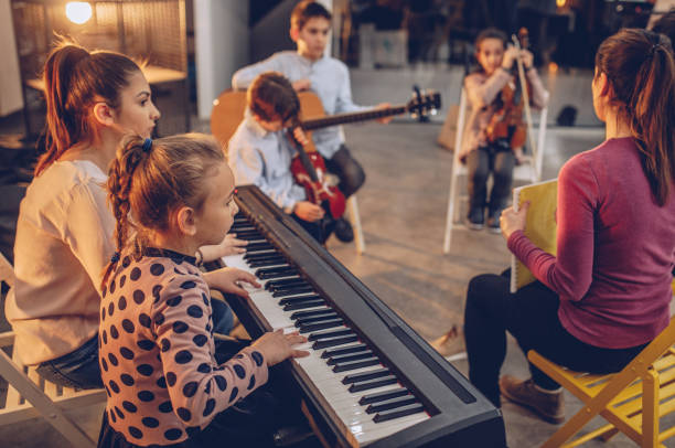 istock Busy day in kids music school 934245740