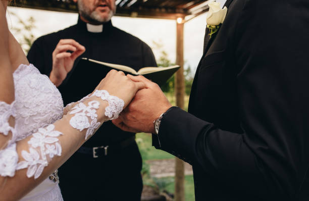 istock Couple exchanging vows on their wedding day 934249326